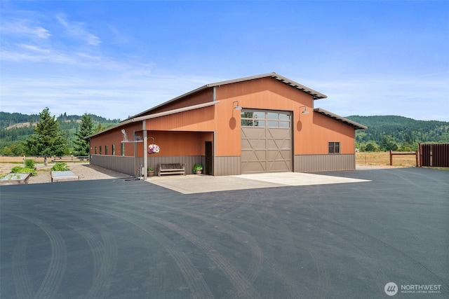 6401 Skookumchuck Rd SE, Tenino, WA 98589 - exterior space featuring fence, an outdoor structure, and a garage