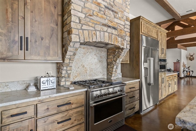 6401 Skookumchuck Rd SE, Tenino, WA 98589 - kitchen with light stone countertops, dark wood-style floors, visible vents, and high quality appliances