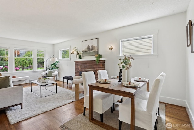 dining room with wood finished floors and baseboards