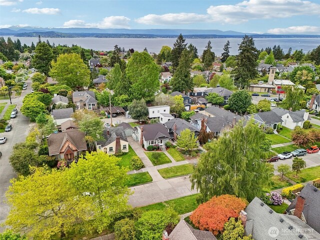 aerial perspective of suburban area featuring a water and mountain view