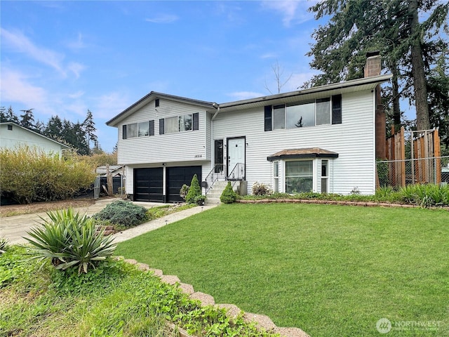 14914 20th Ave E, Parkland, WA 98445 - raised ranch with an attached garage, a chimney, fence, a front lawn, and driveway