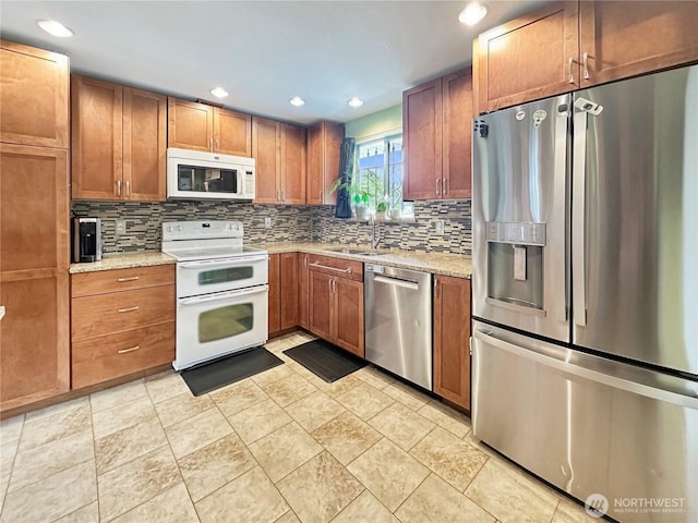 14914 20th Ave E, Parkland, WA 98445 - kitchen featuring a sink, recessed lighting, tasteful backsplash, and appliances with stainless steel finishes