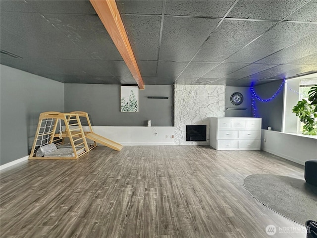 14914 20th Ave E, Parkland, WA 98445 - unfurnished living room with baseboards, a fireplace, visible vents, and wood finished floors