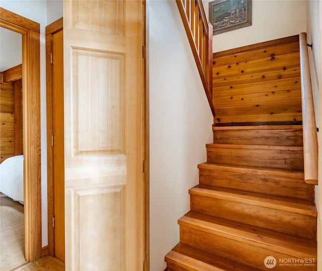 stairs with wood finished floors