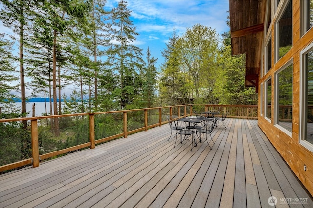 wooden deck with outdoor dining area