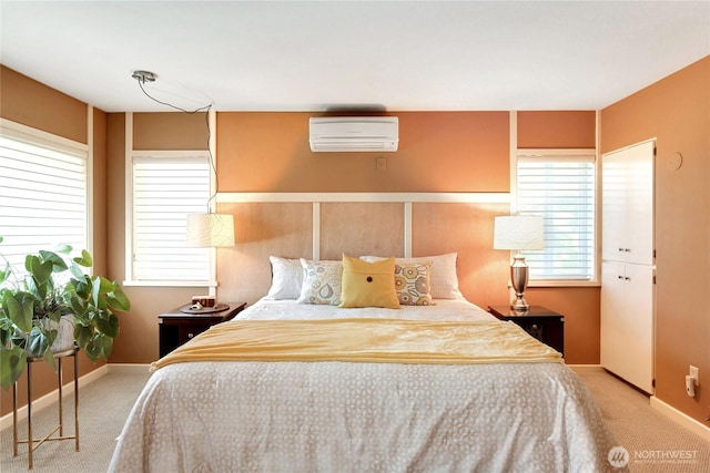 bedroom featuring carpet, an AC wall unit, baseboards, and multiple windows