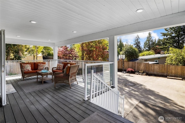deck with fence, a patio area, and an outdoor hangout area