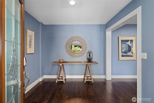 foyer featuring baseboards, dark wood-style floors, and recessed lighting
