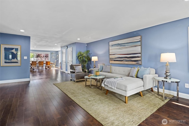 living area featuring baseboards, recessed lighting, and wood-type flooring
