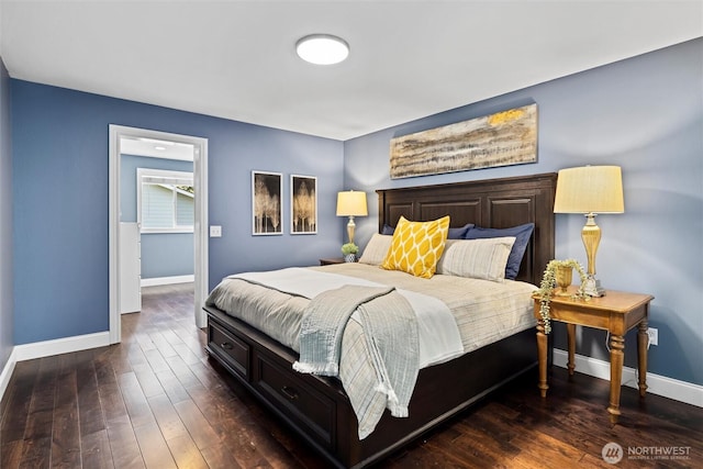 bedroom with baseboards and dark wood-style floors