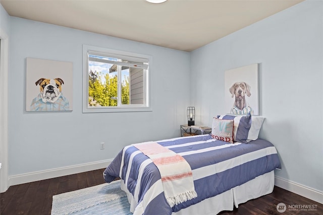 bedroom featuring baseboards and hardwood / wood-style floors
