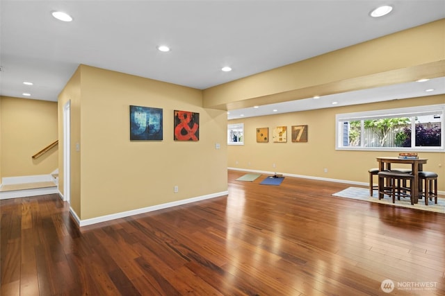 interior space with recessed lighting, hardwood / wood-style floors, and baseboards