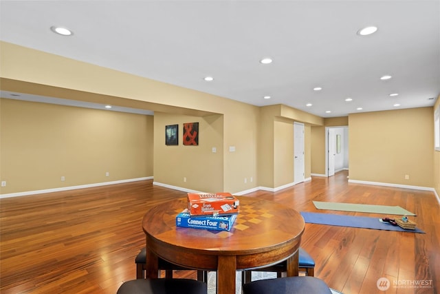 interior space with wood-type flooring, baseboards, and recessed lighting
