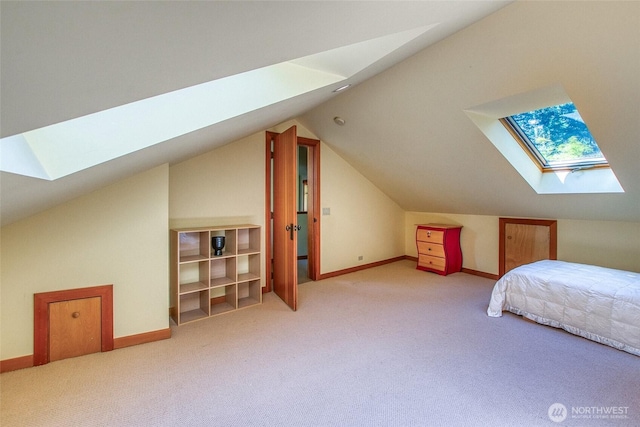 72 Thunderbird Trl, Orcas Island, WA 98280 - carpeted bedroom with a skylight, vaulted ceiling, and baseboards