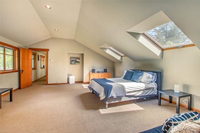72 Thunderbird Trl, Orcas Island, WA 98280 - bedroom featuring a skylight, vaulted ceiling, carpet flooring, and baseboards