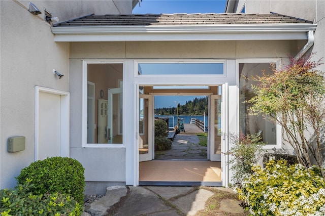 doorway to property with stucco siding