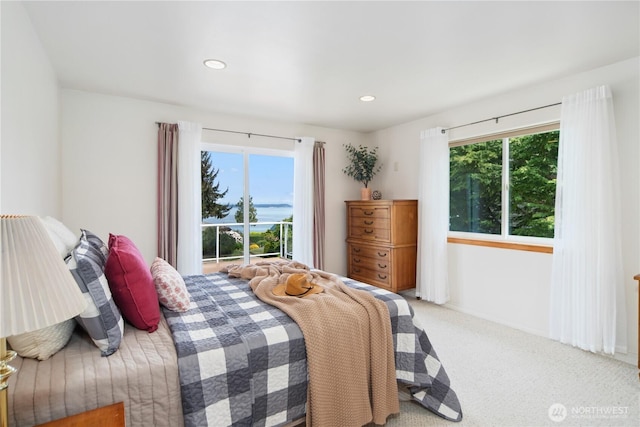 carpeted bedroom with multiple windows and recessed lighting