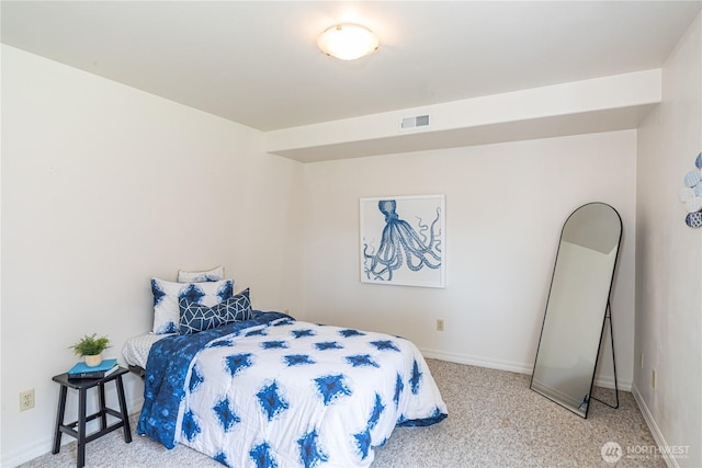 bedroom with carpet floors and baseboards