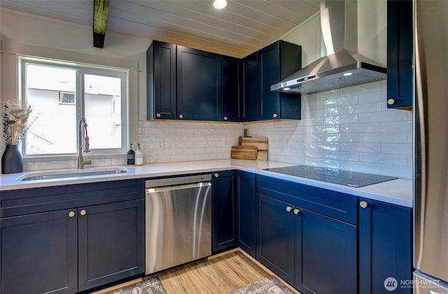 554 Puffin Ave NE, Ocean Shores, WA 98569 - kitchen featuring light countertops, a sink, stainless steel dishwasher, wall chimney range hood, and black electric stovetop