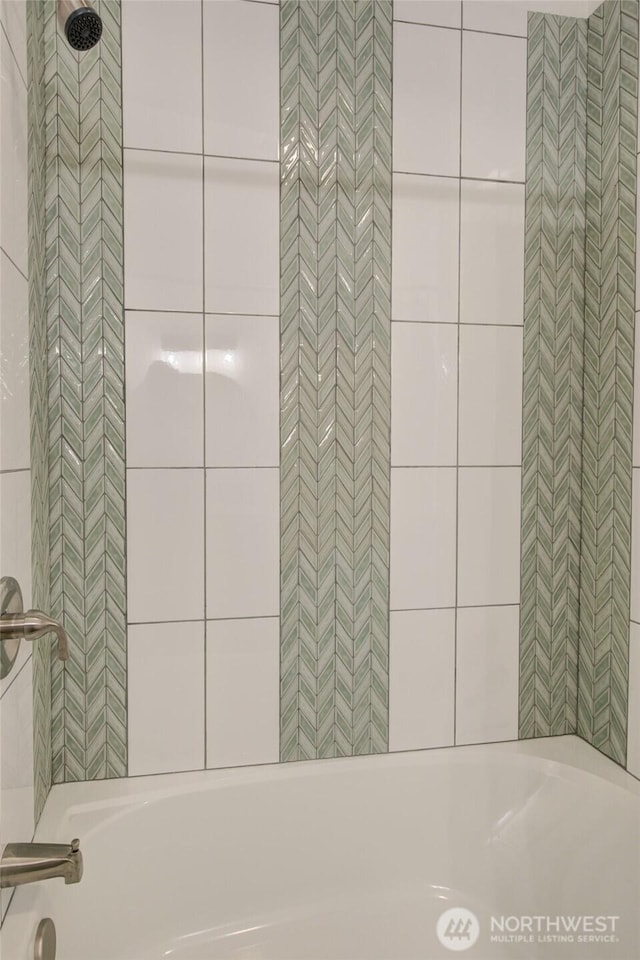 554 Puffin Ave NE, Ocean Shores, WA 98569 - bathroom with a bath and tiled shower