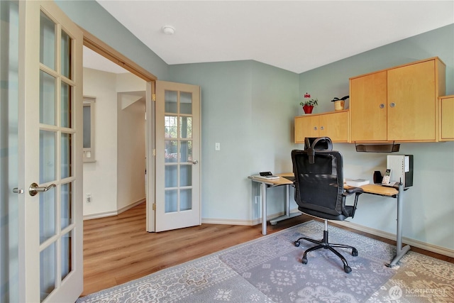 office area with baseboards, french doors, and wood finished floors