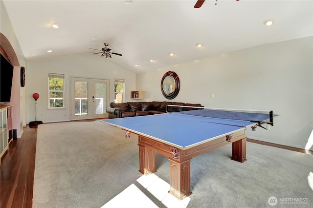 recreation room with lofted ceiling, wood finished floors, french doors, baseboards, and ceiling fan
