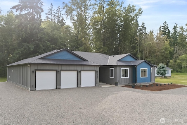 15701 264th St E, Graham, WA 98338 - single story home featuring an attached garage, board and batten siding, and driveway