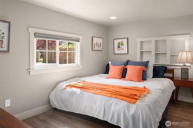 bedroom with baseboards, recessed lighting, and wood finished floors