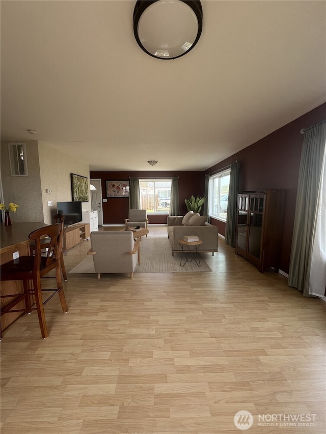 living area featuring light wood finished floors