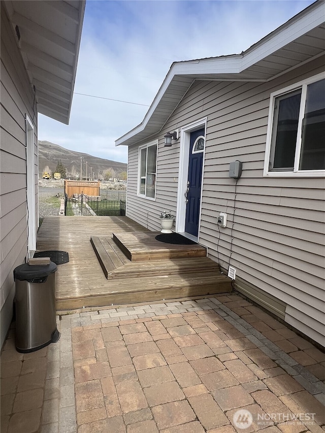 wooden terrace featuring a mountain view