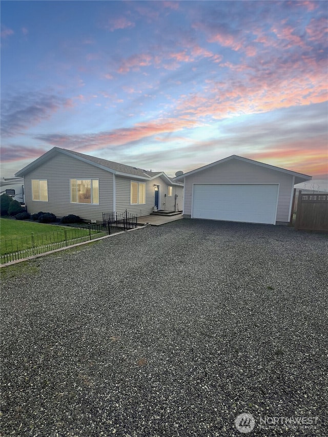 ranch-style home with fence