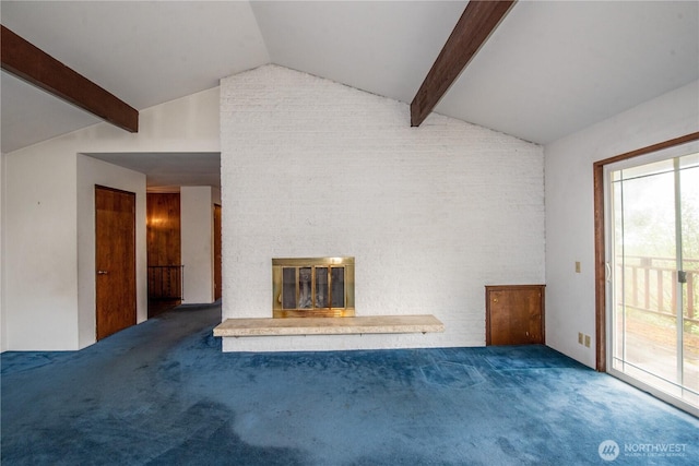 unfurnished living room featuring lofted ceiling with beams, carpet flooring, and a fireplace