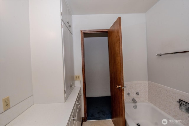 full bathroom with a whirlpool tub