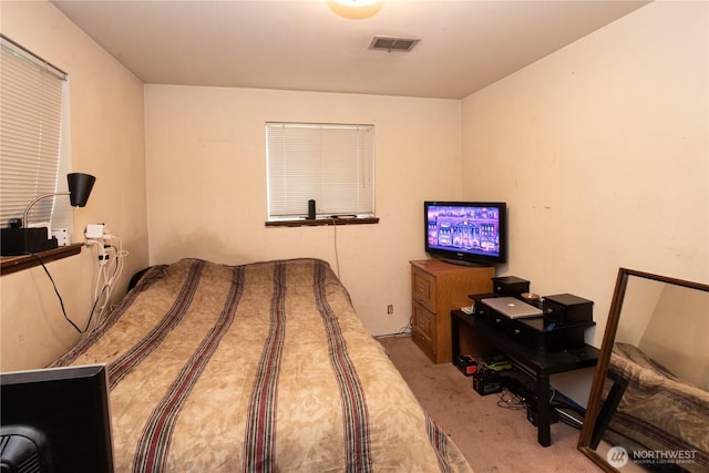 bedroom with carpet and visible vents