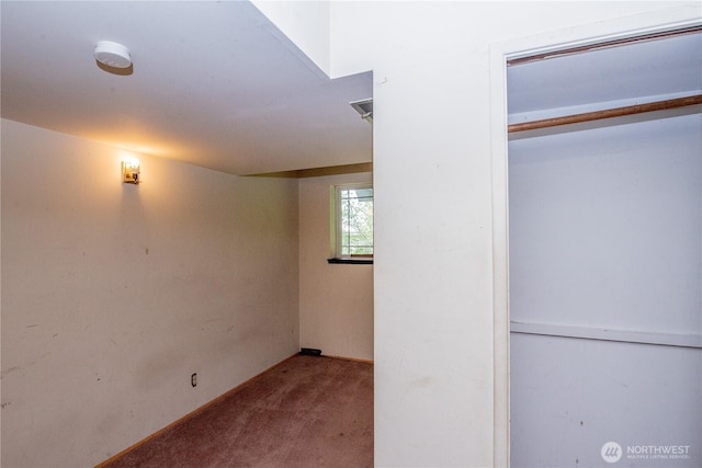 below grade area featuring carpet flooring