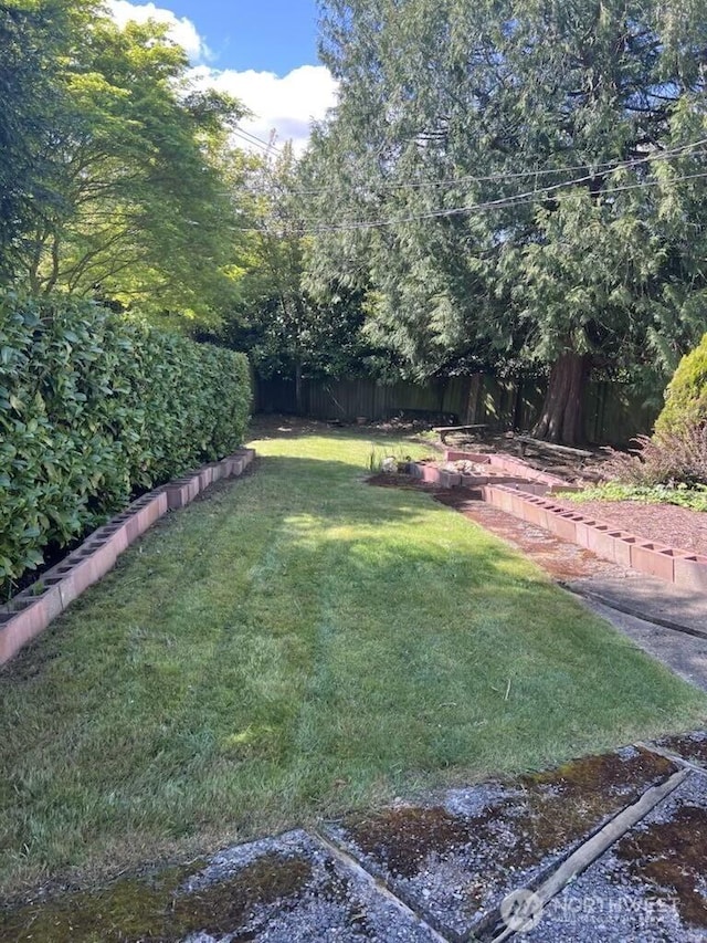 view of yard with fence