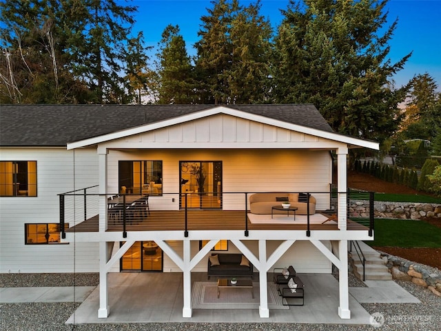 11016 46th St E, Edgewood, WA 98372 - rear view of house with a shingled roof, a patio, a balcony, and board and batten siding