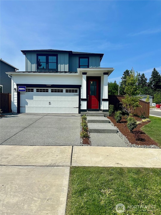 13488 NE 104th Way Unit 6, Kirkland, WA 98033 - view of front of house featuring board and batten siding, driveway, and an attached garage