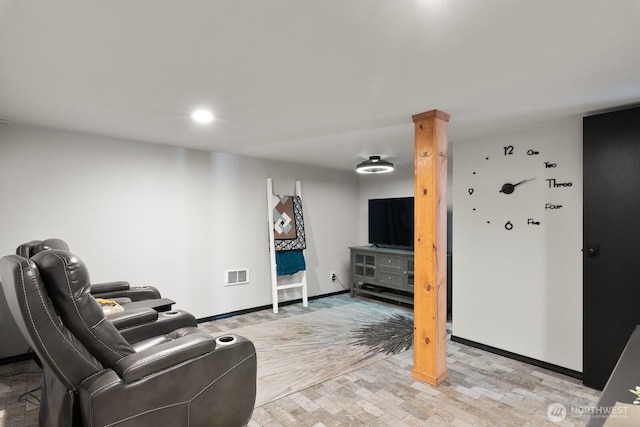 living area featuring recessed lighting, baseboards, visible vents, and light wood-style flooring