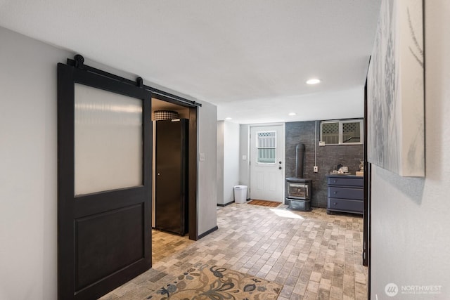 bathroom with vanity, a wood stove, brick floor, and recessed lighting