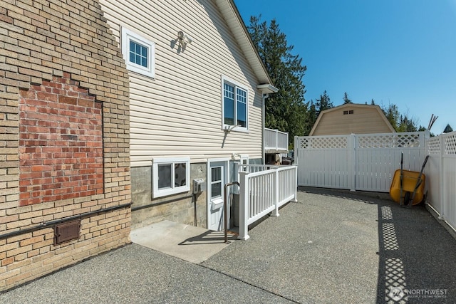view of patio featuring fence