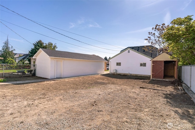 exterior space with fence and an outdoor structure