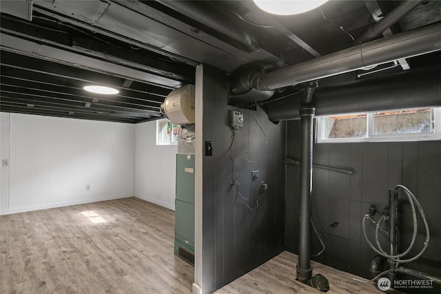 below grade area featuring wood finished floors