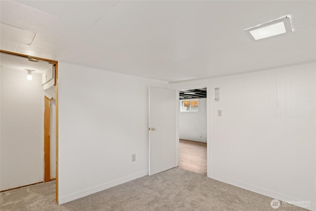basement featuring carpet floors and baseboards