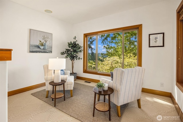 sitting room featuring baseboards