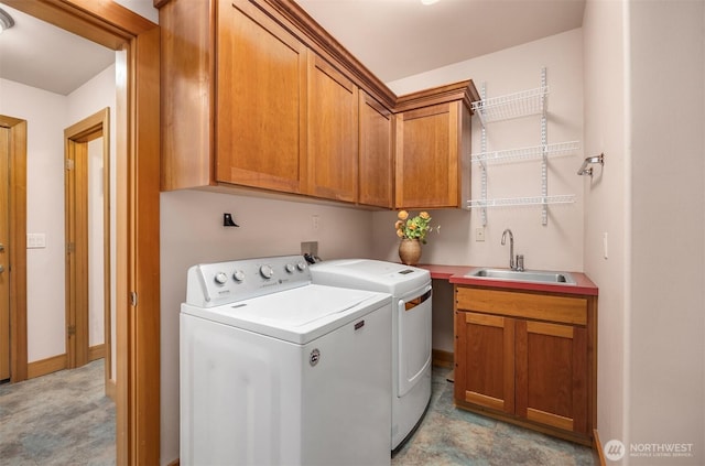 washroom with washing machine and dryer and cabinet space