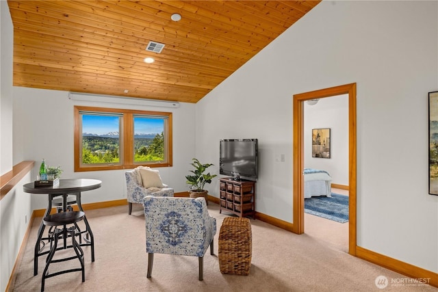 living area with wood ceiling, carpet, baseboards, and vaulted ceiling