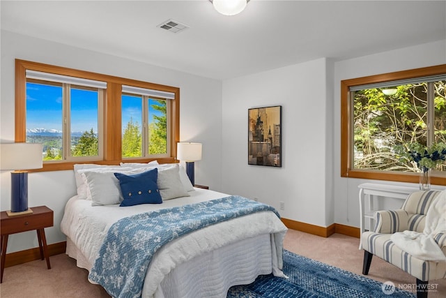bedroom featuring carpet and baseboards