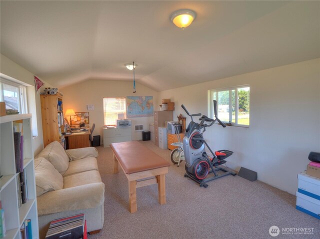 carpeted living room with visible vents, a healthy amount of sunlight, and lofted ceiling