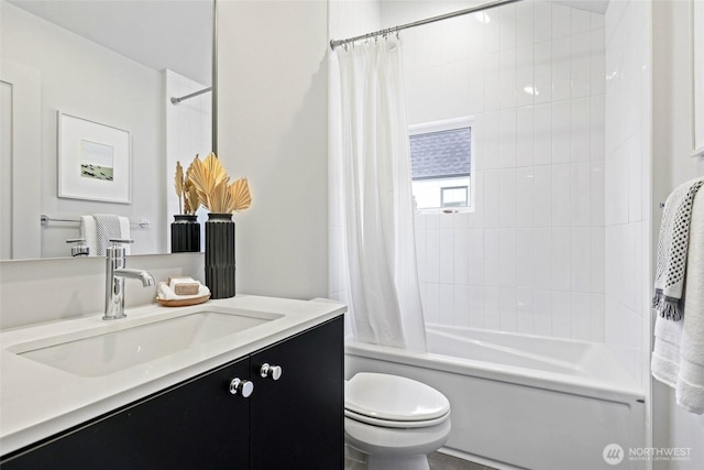 bathroom with shower / bath combo with shower curtain, vanity, and toilet